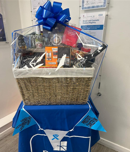 hamper of food and drink with big blue bow